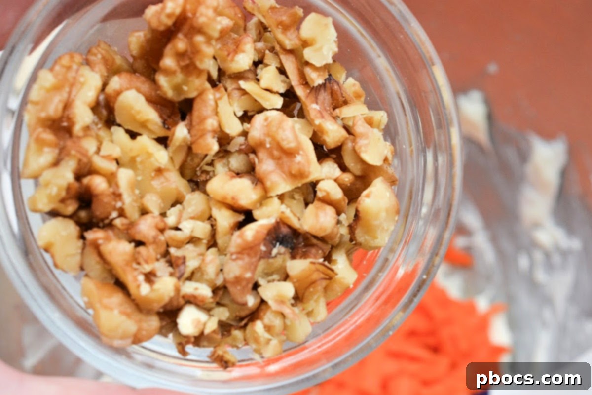 Keto Carrot Cake Swirls 10 Adding chopped walnuts to the mixture