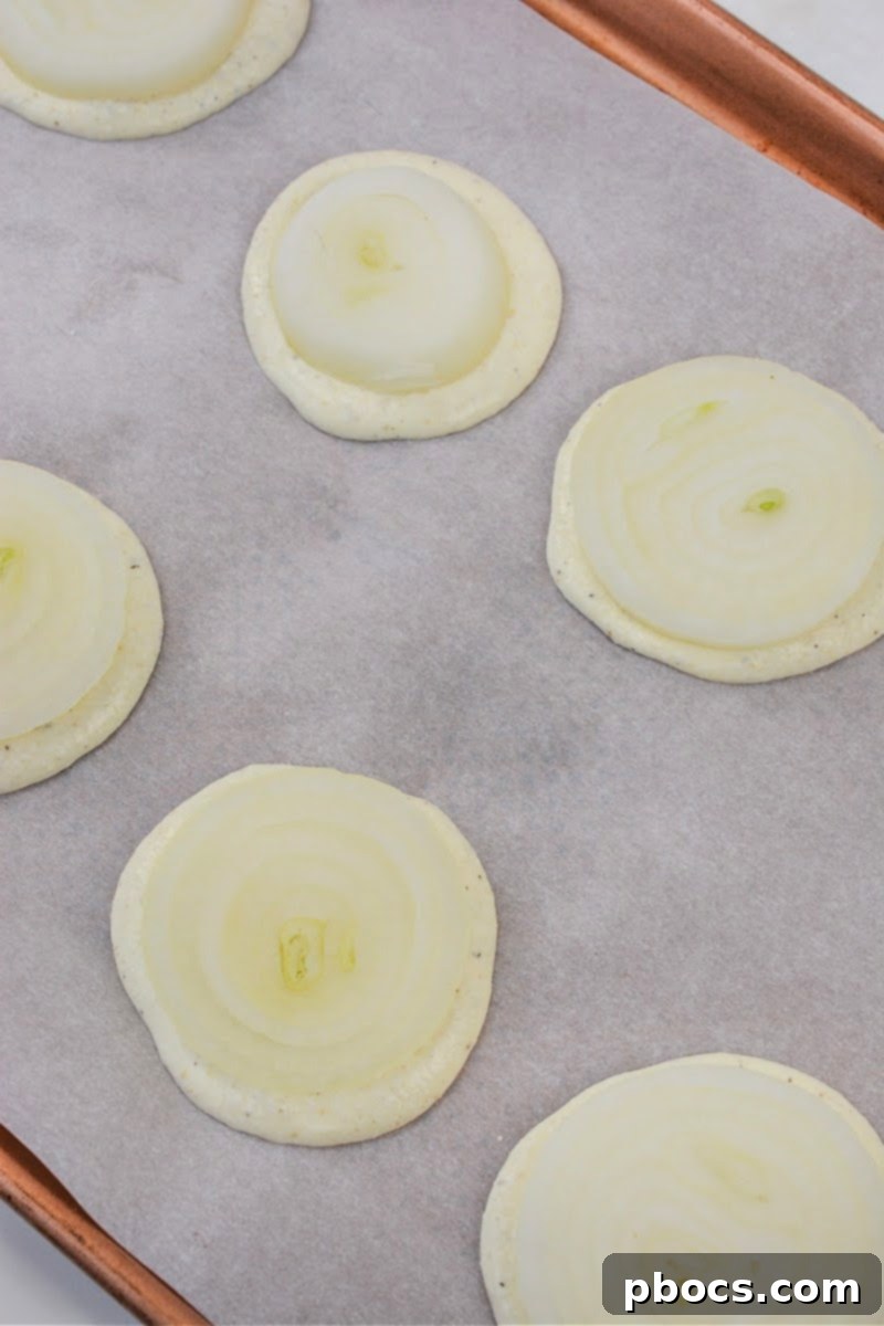Placing onions on top of raw batter