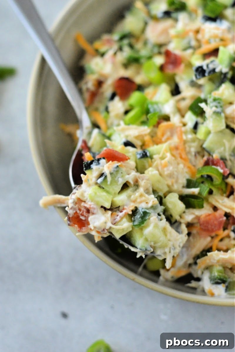 Keto Jalapeno Popper Chicken Cucumber Salad stored in a container