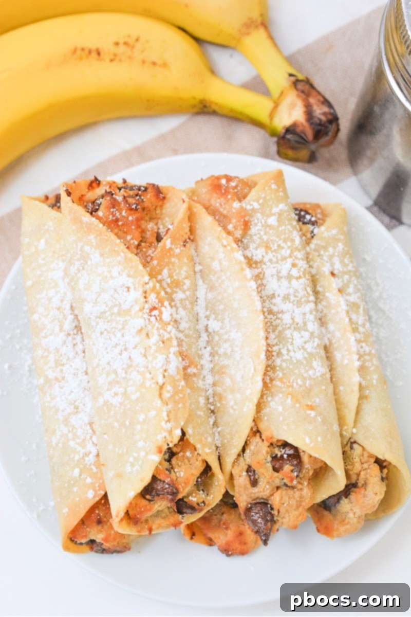 Assembled Crispy Low Carb Chocolate Chip Peanut Butter Roll Ups chilling in the freezer