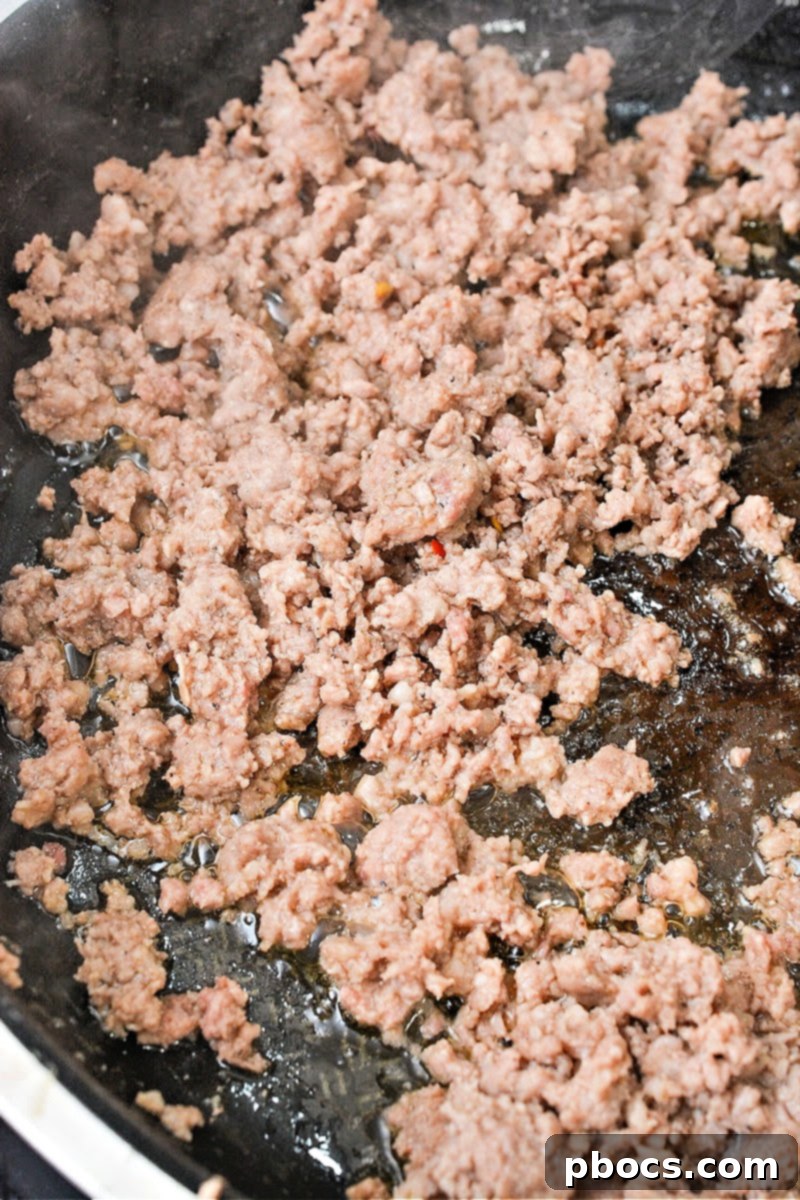 Protein-Rich Low Carb Cottage Cheese Pancakes with Sausage 9 Browning sausage in a skillet