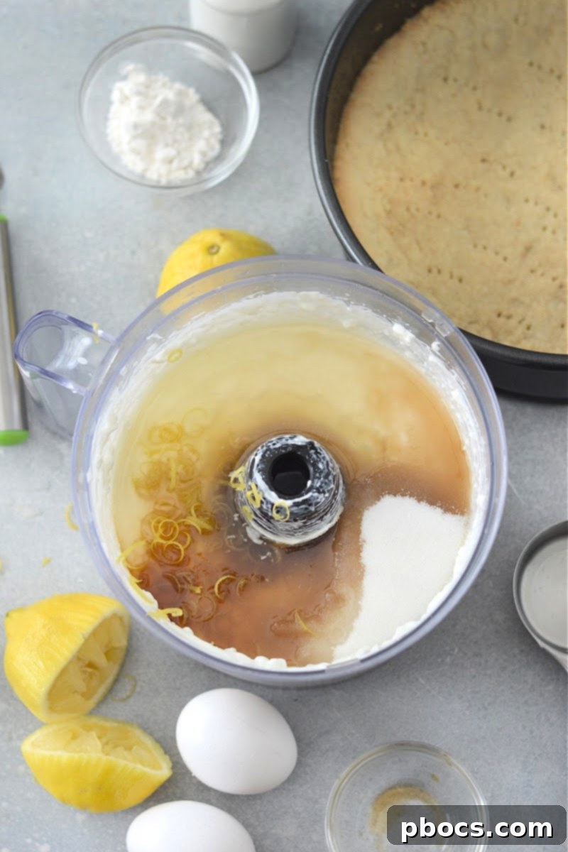 Mixing cheesecake filling in food processor