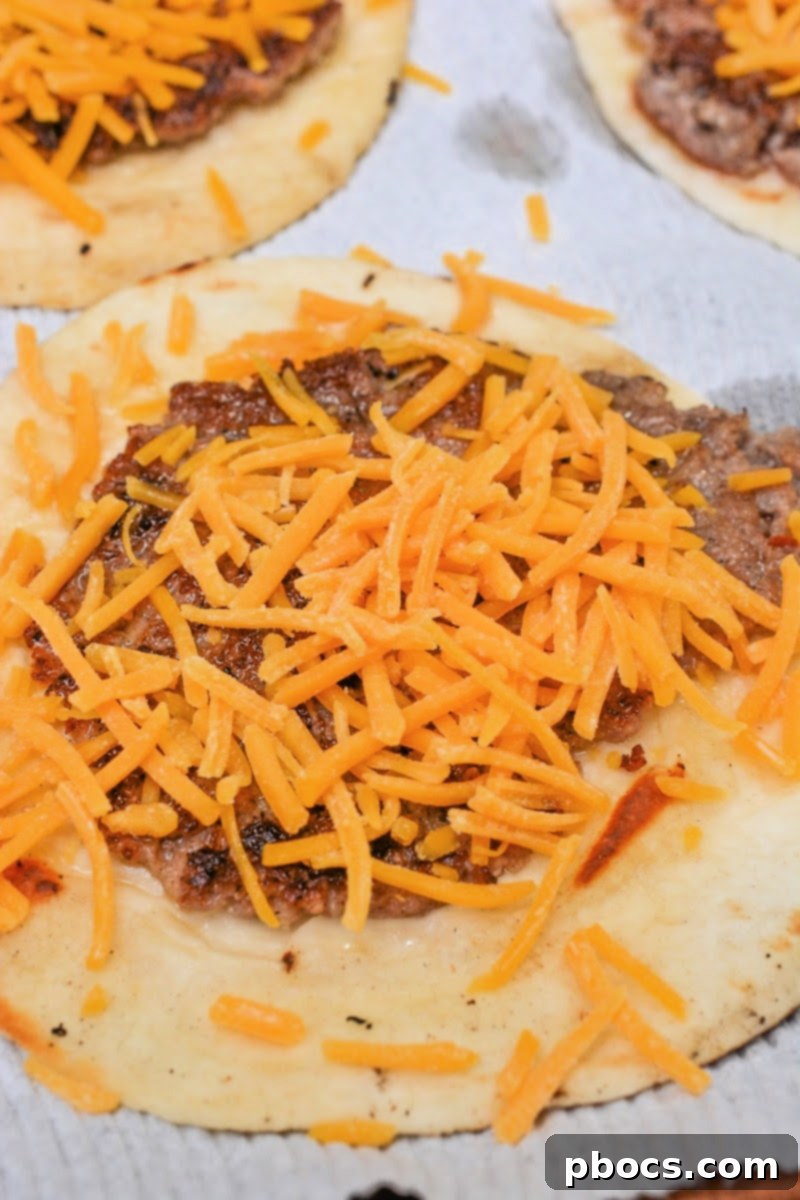 Keto Morning Smash Burger Bites 11 Adding cheese to the sausage