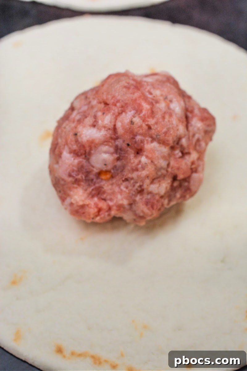 Keto Morning Smash Burger Bites 9 A ball of raw sausage