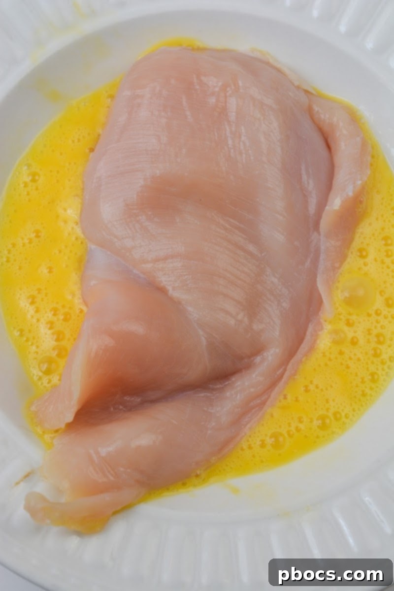 Keto Chicken and Spinach Noodles 10 Adding eggs to raw chicken