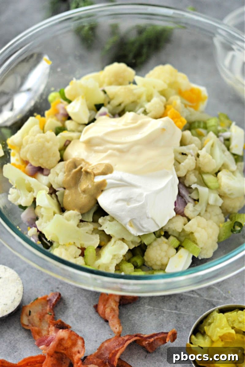 Adding mayo and mustard