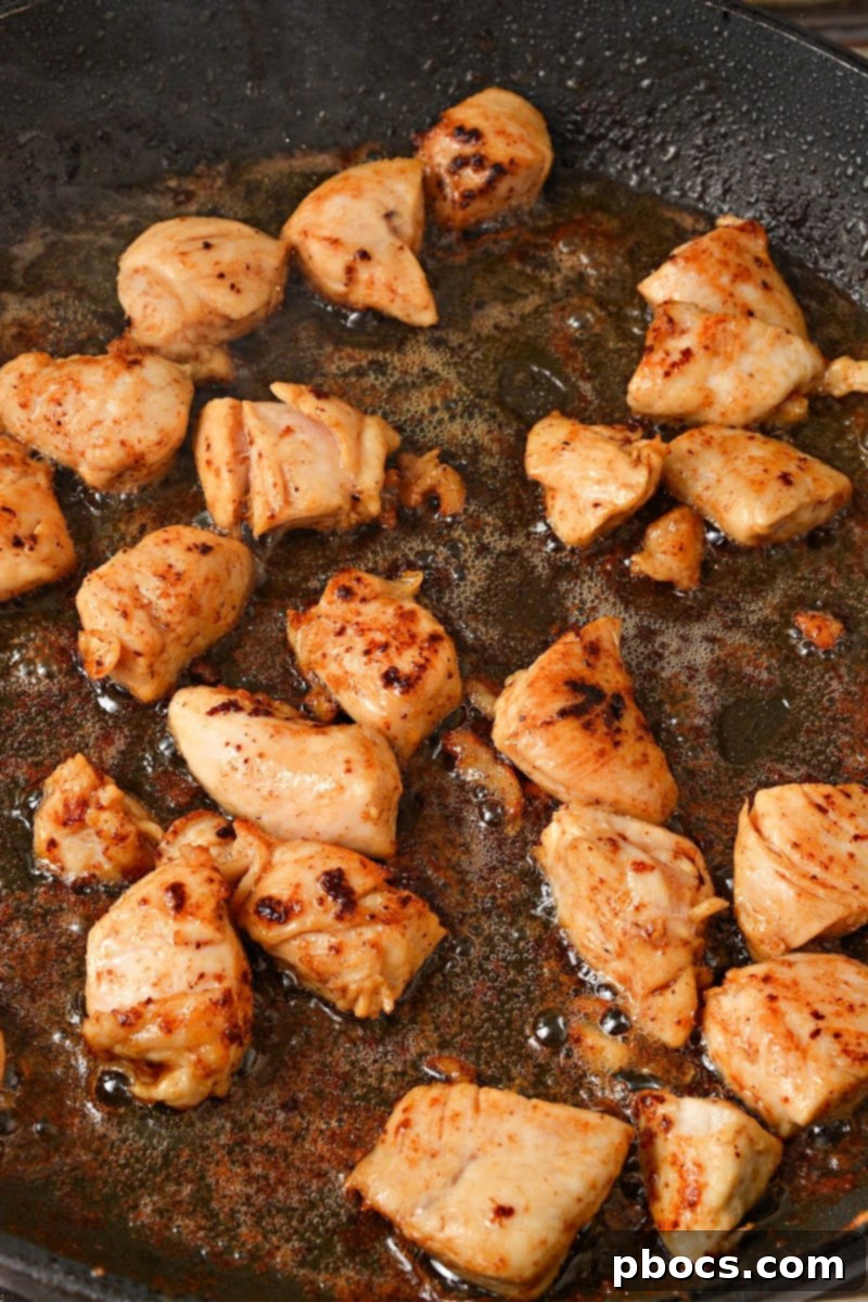 Cooking chicken pieces in a skillet