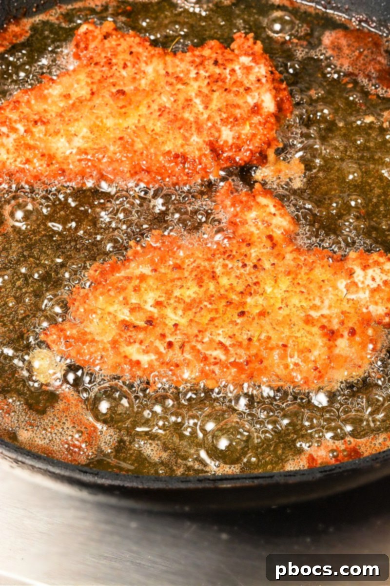 Frying keto chicken cutlets in a skillet