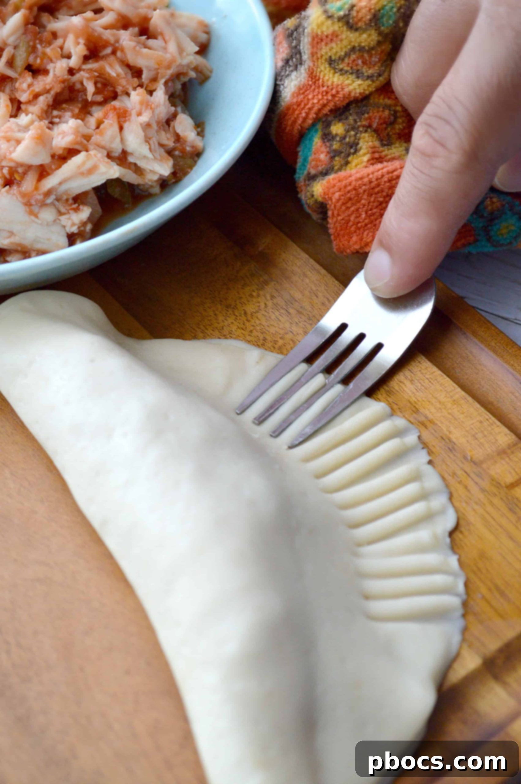 Sealing empanada edges with a fork