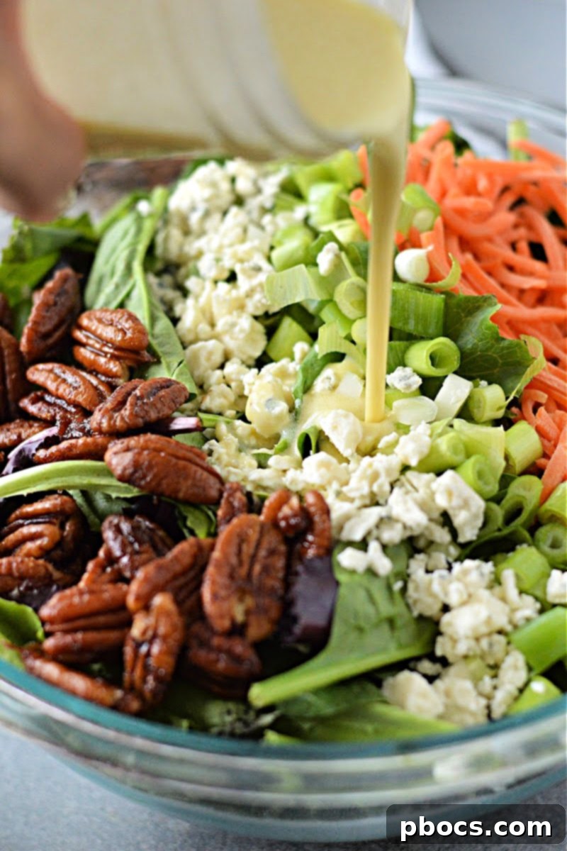 Adding dressing to the chopped salad