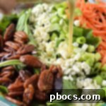 Adding dressing to the salad