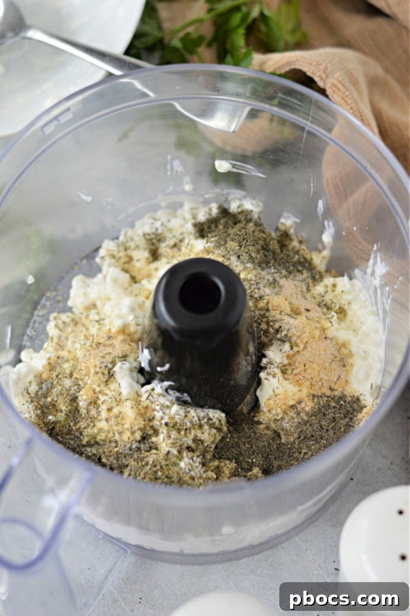 Putting the ingredients for the dip in the food processor