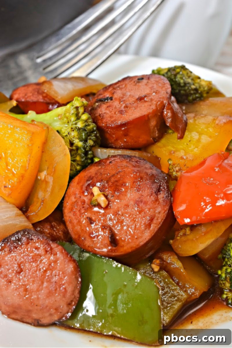 A finished serving of Low Carb Asian Sweet and Sour Kielbasa with bell peppers and onions, ready to be enjoyed