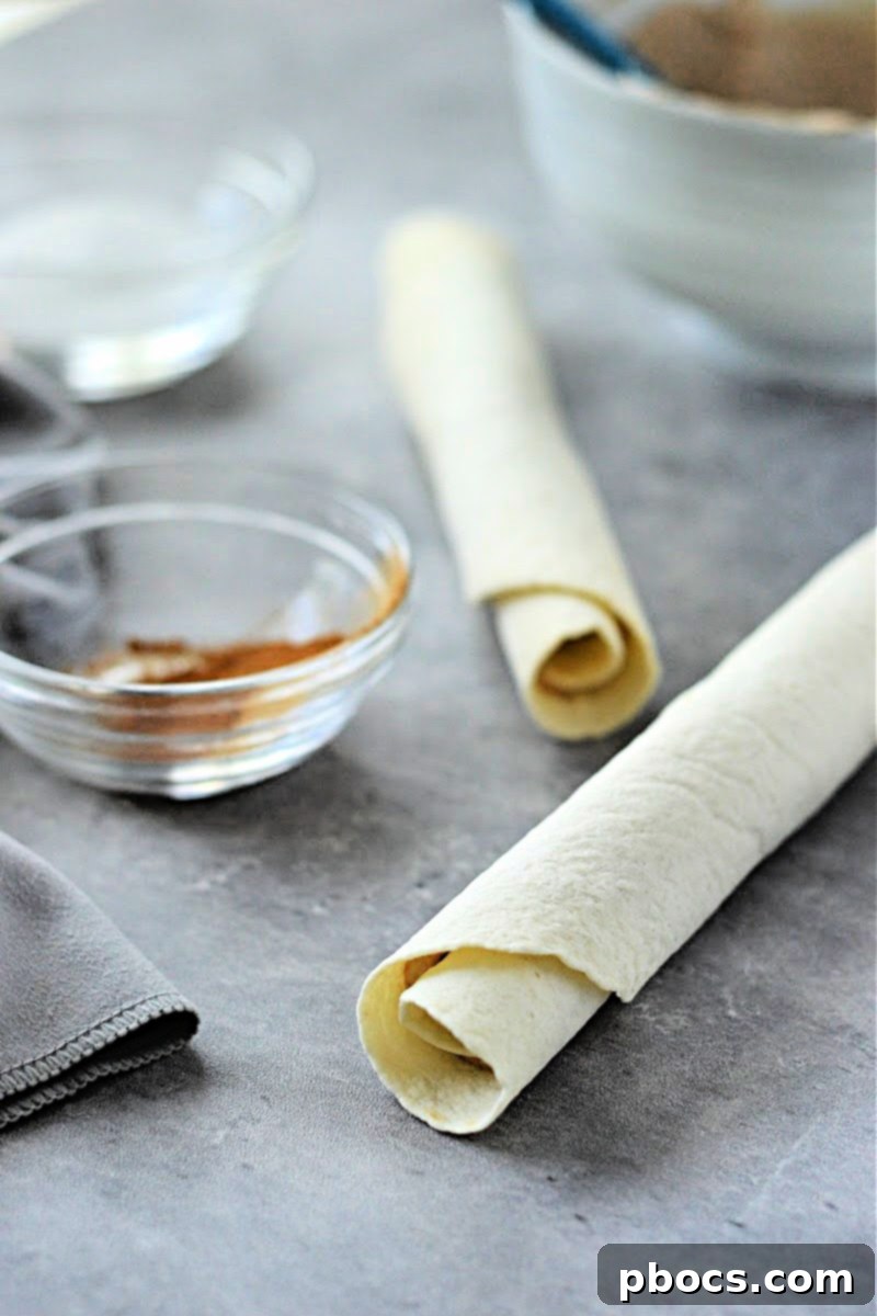 Keto Cinnamon Cream Cheese Delights 11 Slicing chilled tortillas into spirals