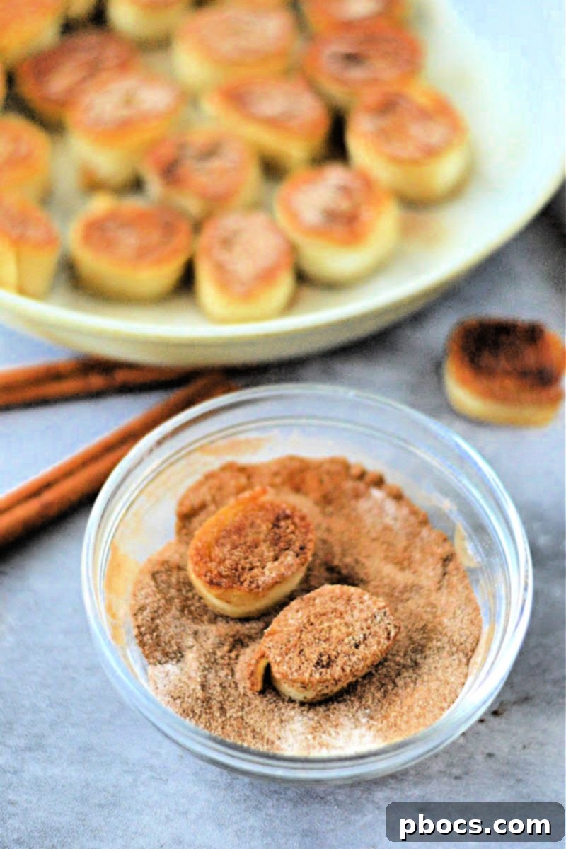 Keto Cinnamon Cream Cheese Delights 14 Sprinkling cinnamon sugar over finished keto bites