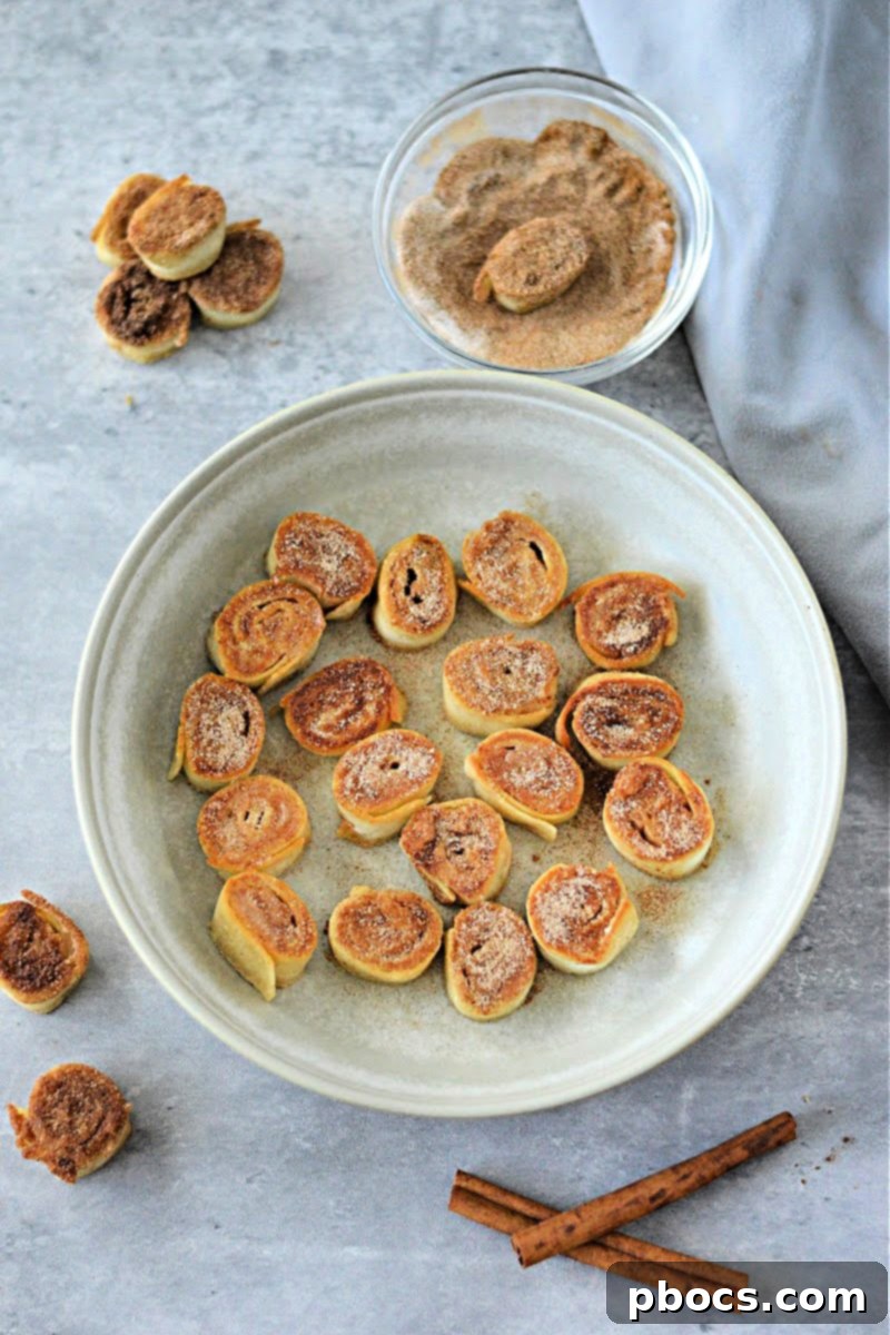 Keto Cinnamon Cream Cheese Delights 7 Keto Cinnamon Cream Cheese Bites being pan-fried in butter