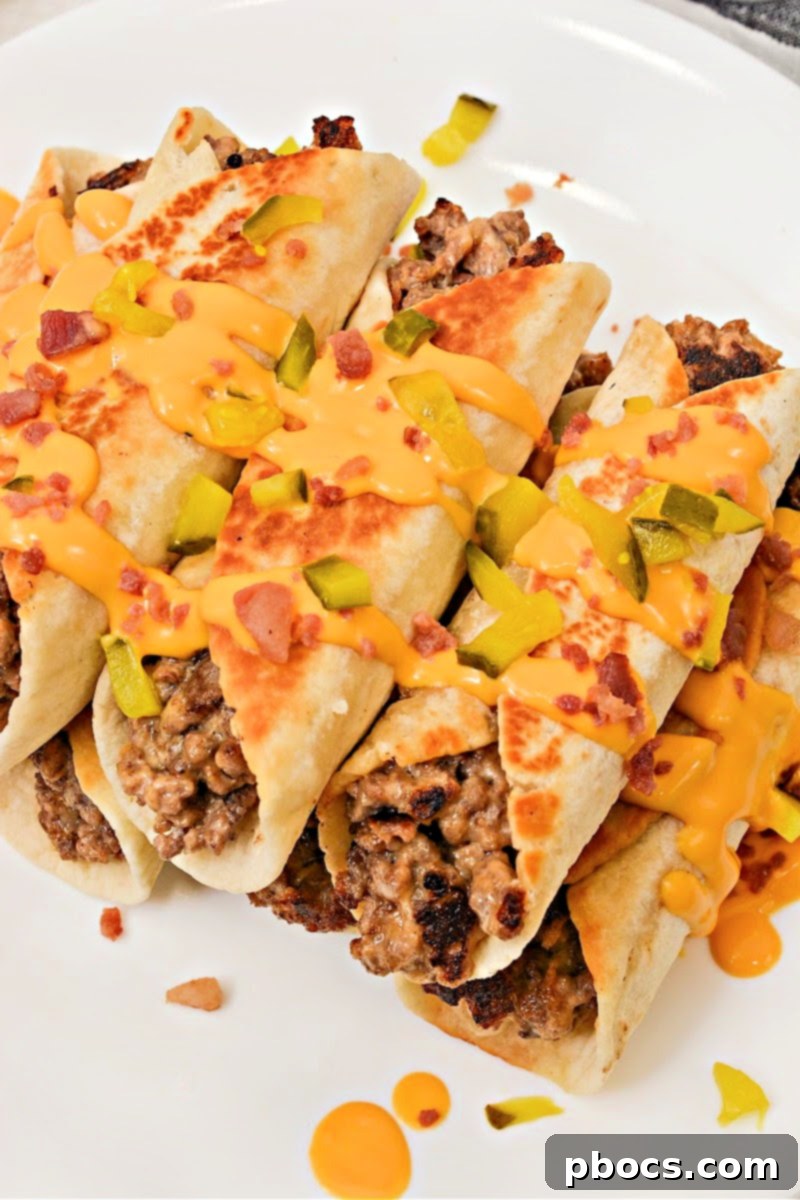 Keto Beef & Cheese Spirals 5 Crispy Keto Cheesy Beef Roll Ups garnished with diverse toppings like pickles, bacon, and cheese sauce