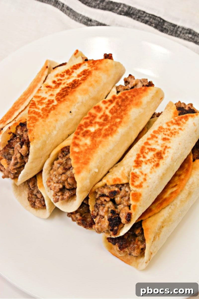 Keto Beef & Cheese Spirals 7 Keto Cheesy Beef Roll Ups perfectly stored in an airtight container for meal prep