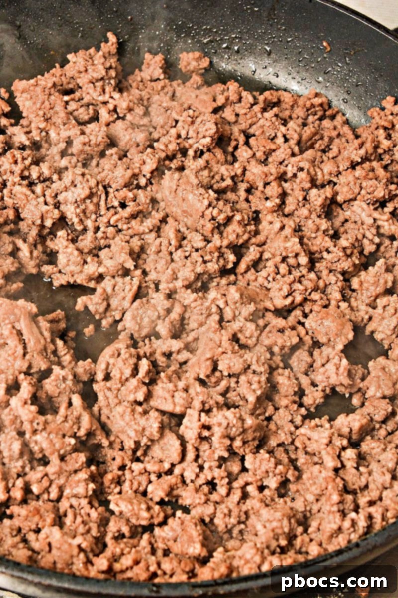 Keto Beef & Cheese Spirals 9 Browning ground beef in a skillet, seasoned with garlic and onion powder, for cheesy roll ups