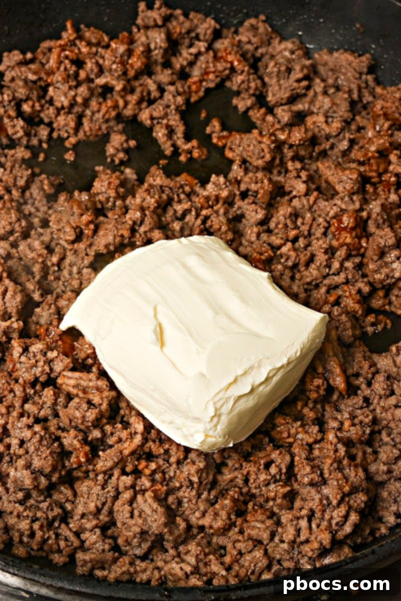 Keto Beef & Cheese Spirals 10 Mixing softened cream cheese into the seasoned ground beef mixture for roll ups