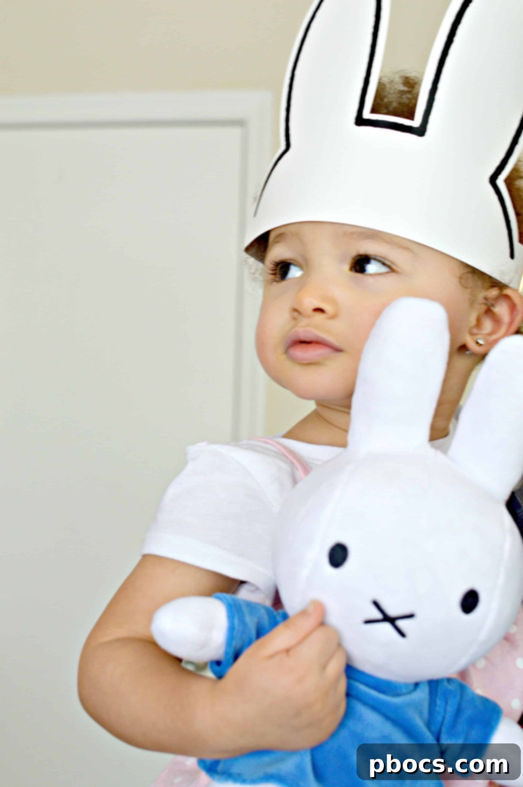 Miffy plush toy and children's book on a cozy blanket