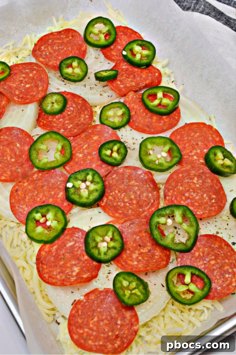 Onion rings and seasonings added to the cheese base