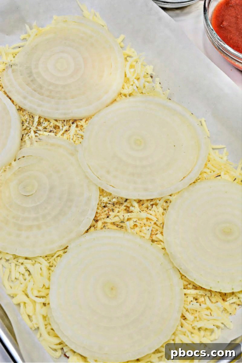 Mozzarella and parmesan cheese laid out for the pizza base