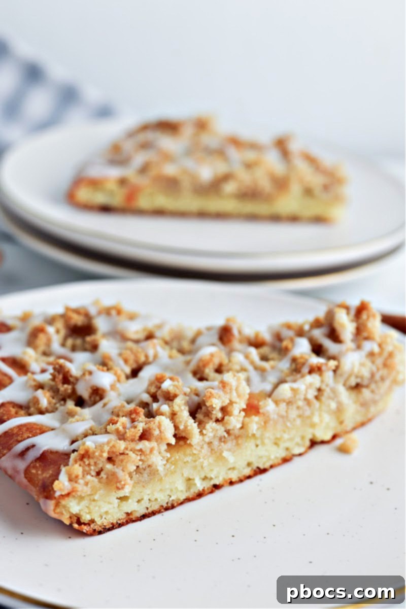 Keto Cinnamon Sugar Dessert Pizza freshly baked and drizzled with glaze.
