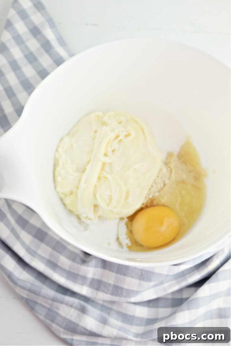 Mixing fathead dough ingredients in a bowl.