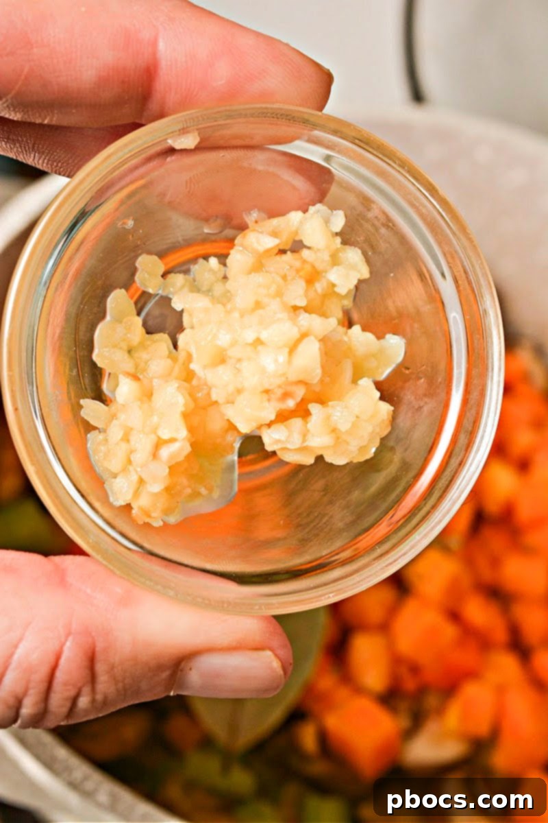 Chicken and broth added to the soup pot