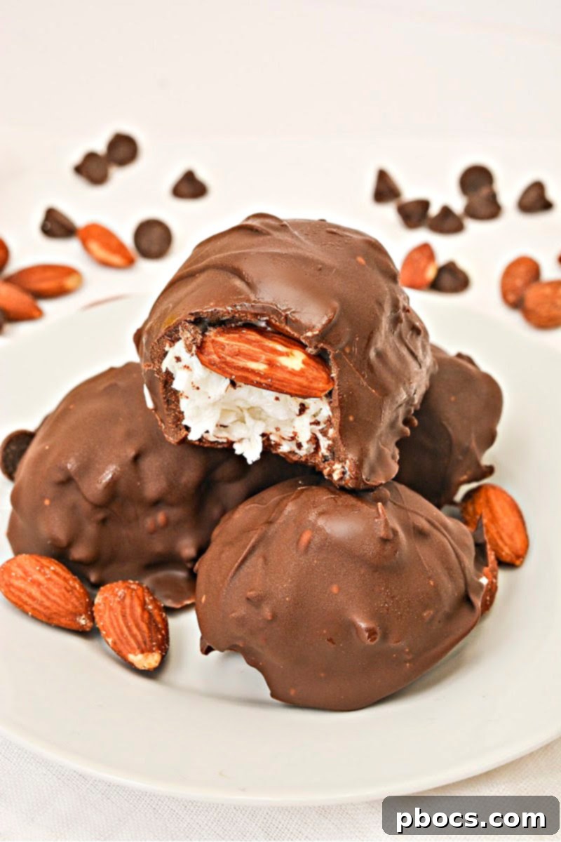 Keto Coco-Almond Bliss Bites 5 Neatly formed coconut and almond clusters arranged on parchment paper