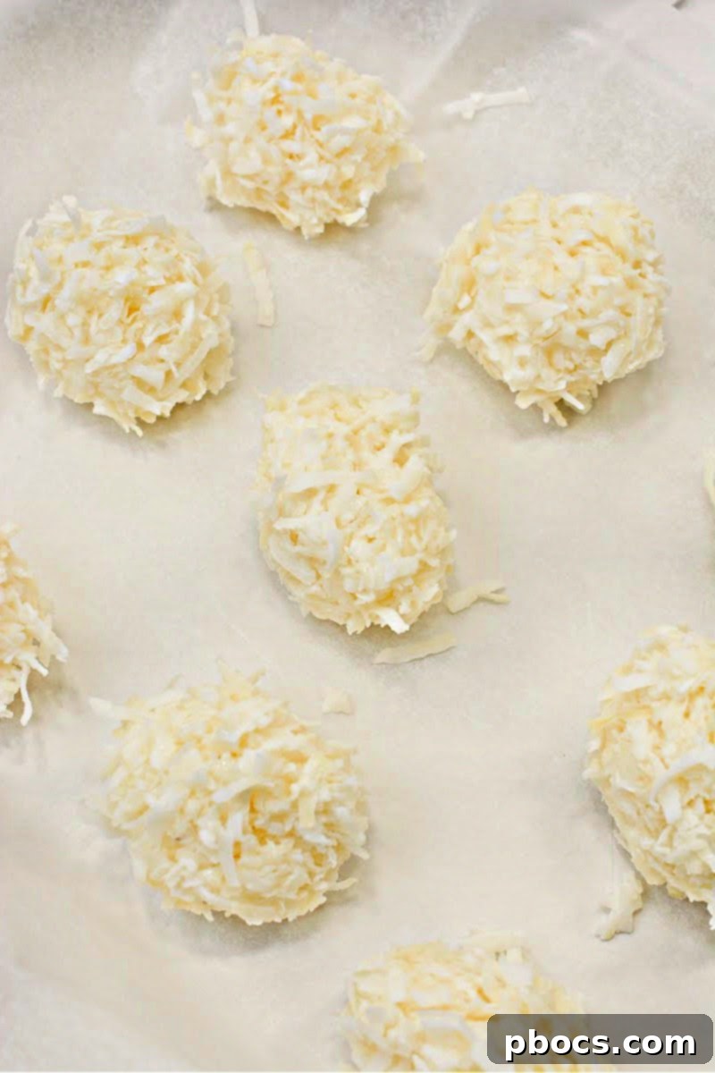 Keto Coco-Almond Bliss Bites 9 Step-by-step: Adding whole almonds to each coconut cluster