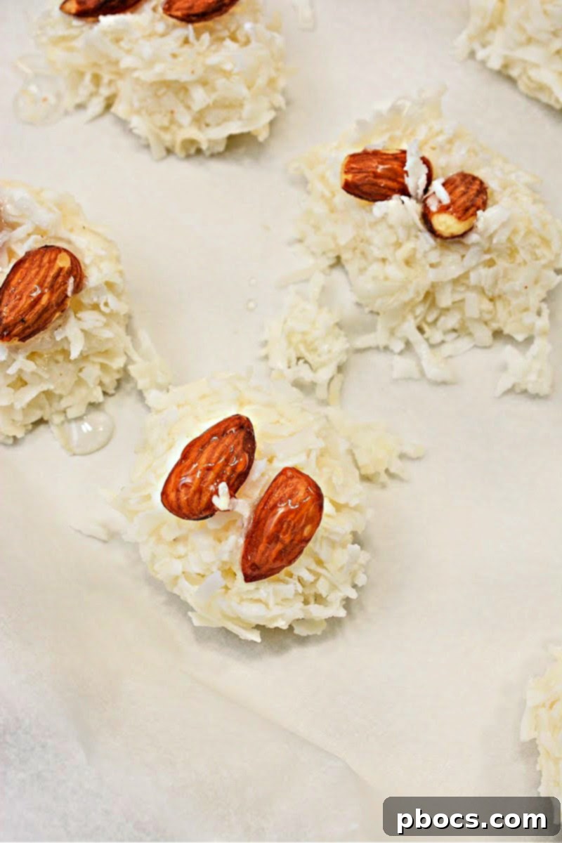 Keto Coco-Almond Bliss Bites 10 Step-by-step: Frozen coconut clusters with almonds, ready for chocolate dipping