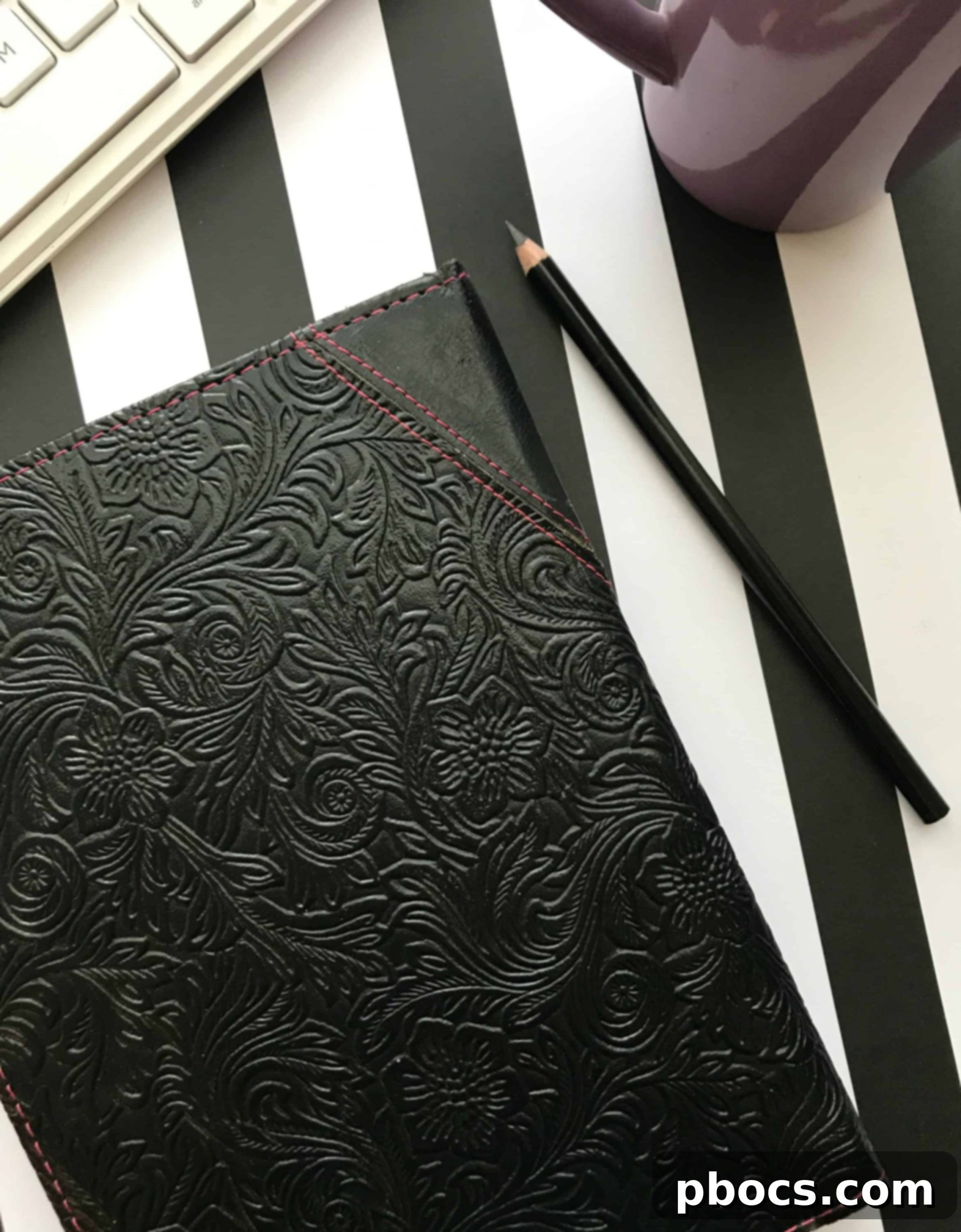 Open gratitude journal next to a cup of coffee