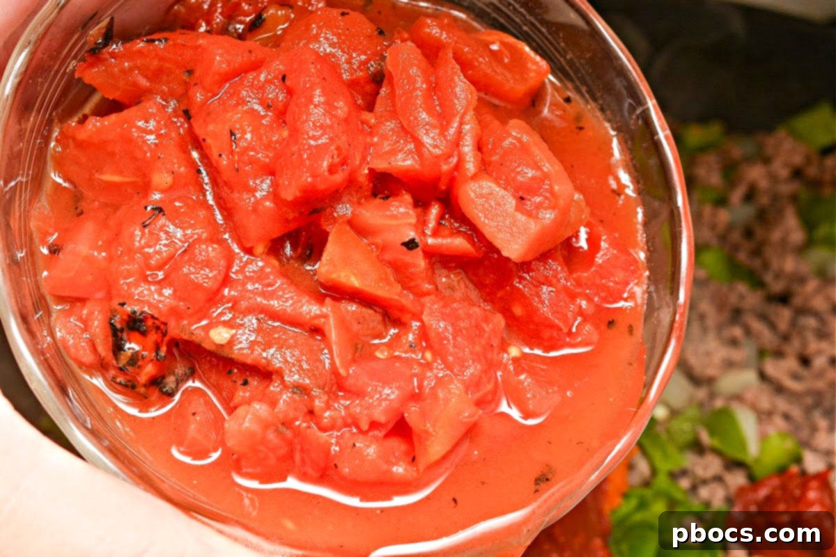 Adding ingredients to Low Carb Pumpkin Chili Sloppy Joe Skillet