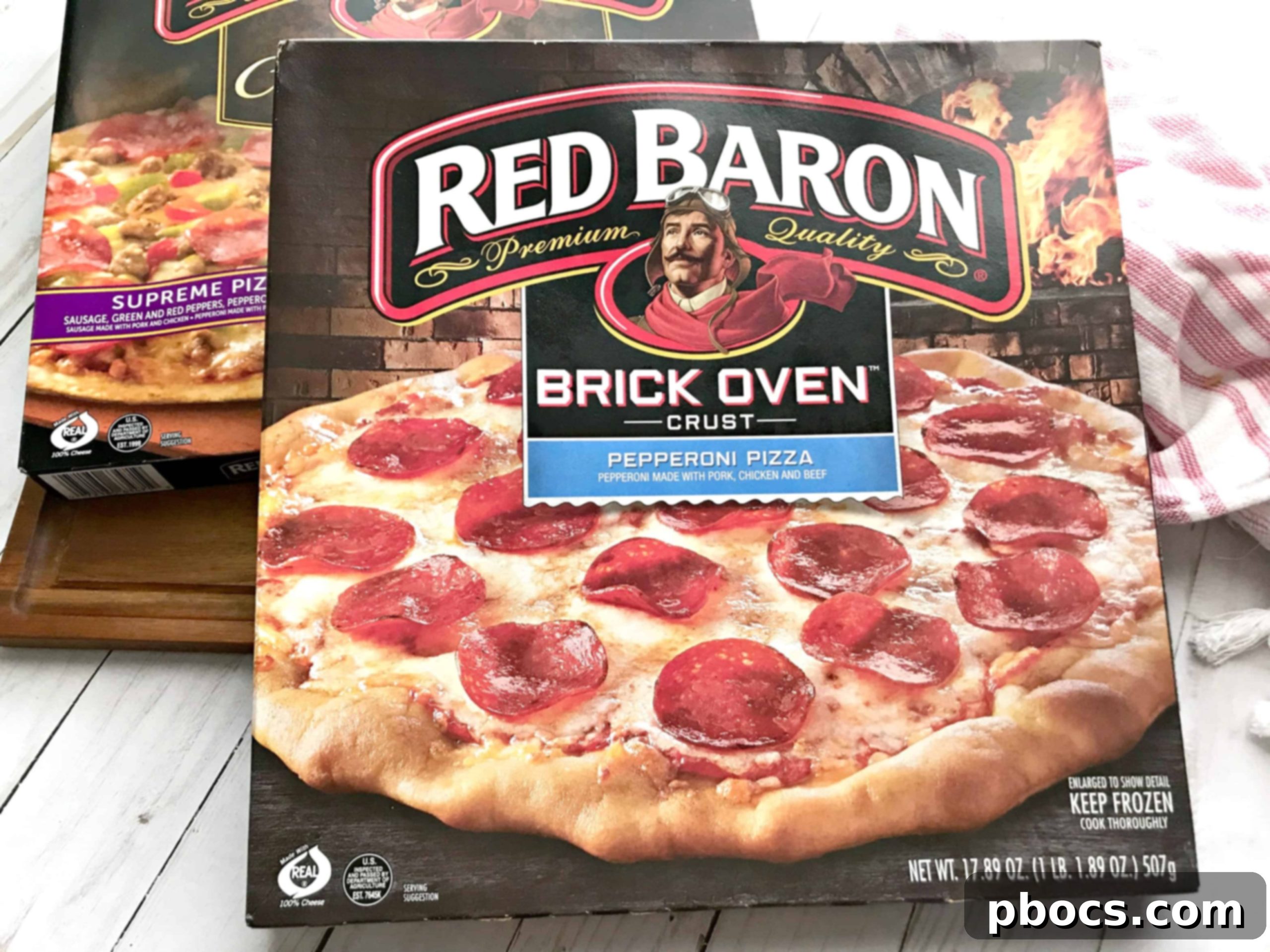 How I Get It All Done + Easy To Make Mushroom & Corn Salad A work-at-home mom smiling while managing children and holding a pizza box, symbolizing easy family dinners.