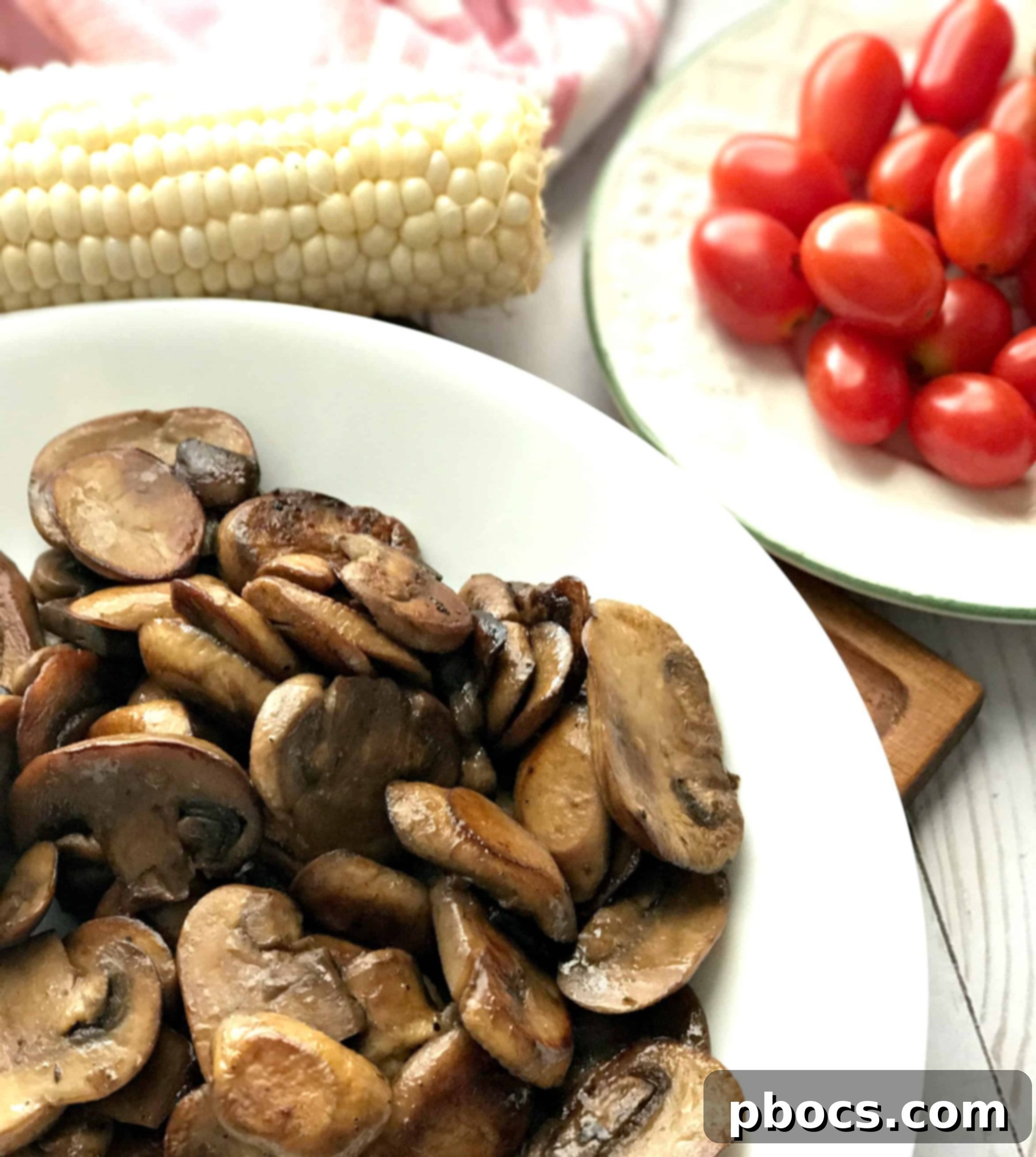 How I Get It All Done + Easy To Make Mushroom & Corn Salad Fresh corn kernels being sliced off the cob, ready for the mushroom and corn salad recipe.