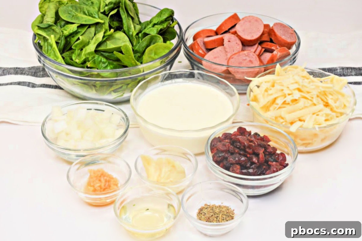 Step 3: Wilting spinach and cranberries into the creamy sauce