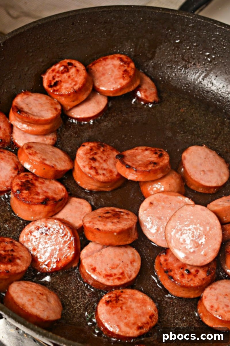 Step 1: Sautéing kielbasa in olive oil until browned