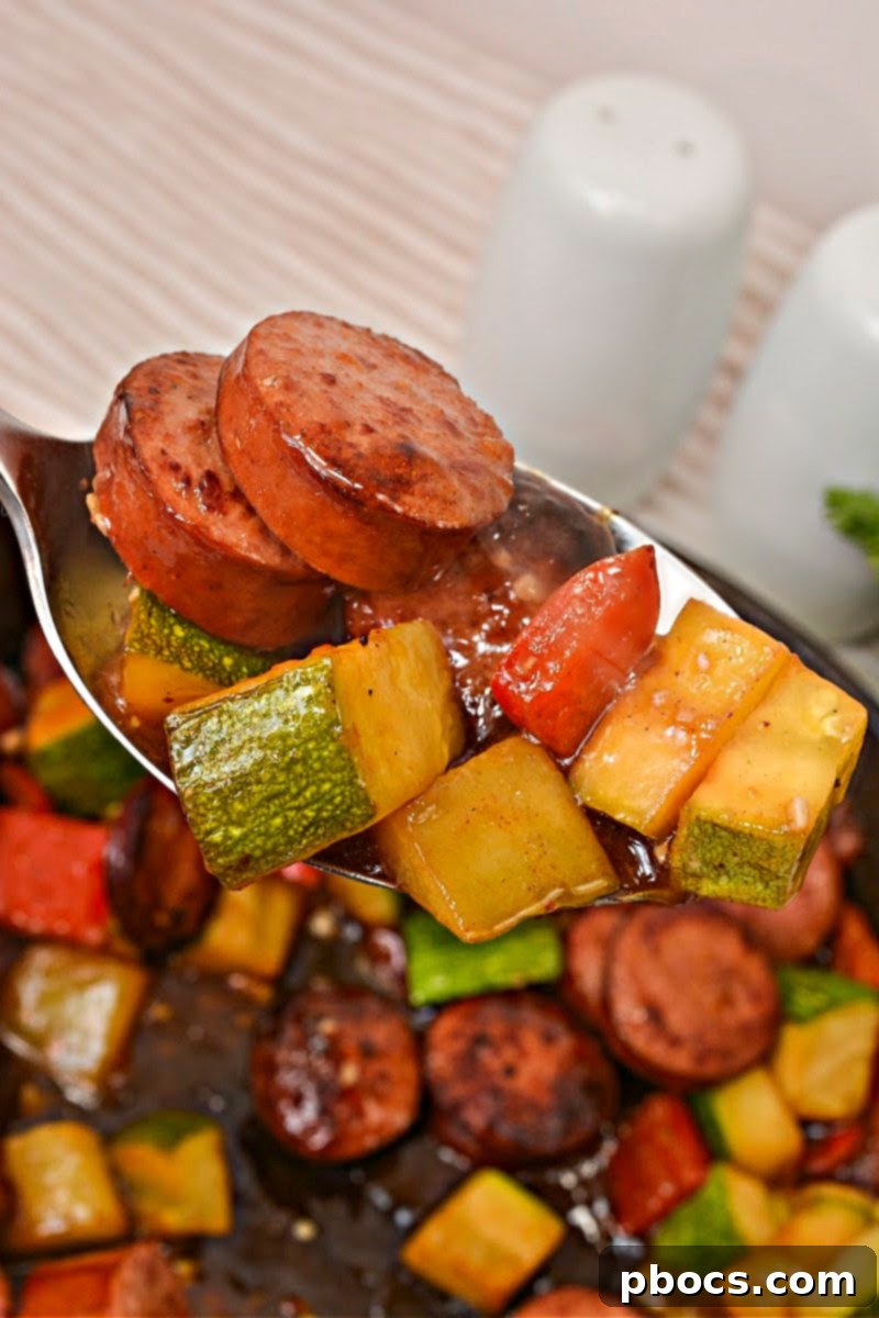 Keto Kung Pao Kielbasa cooked with zucchini and red bell pepper