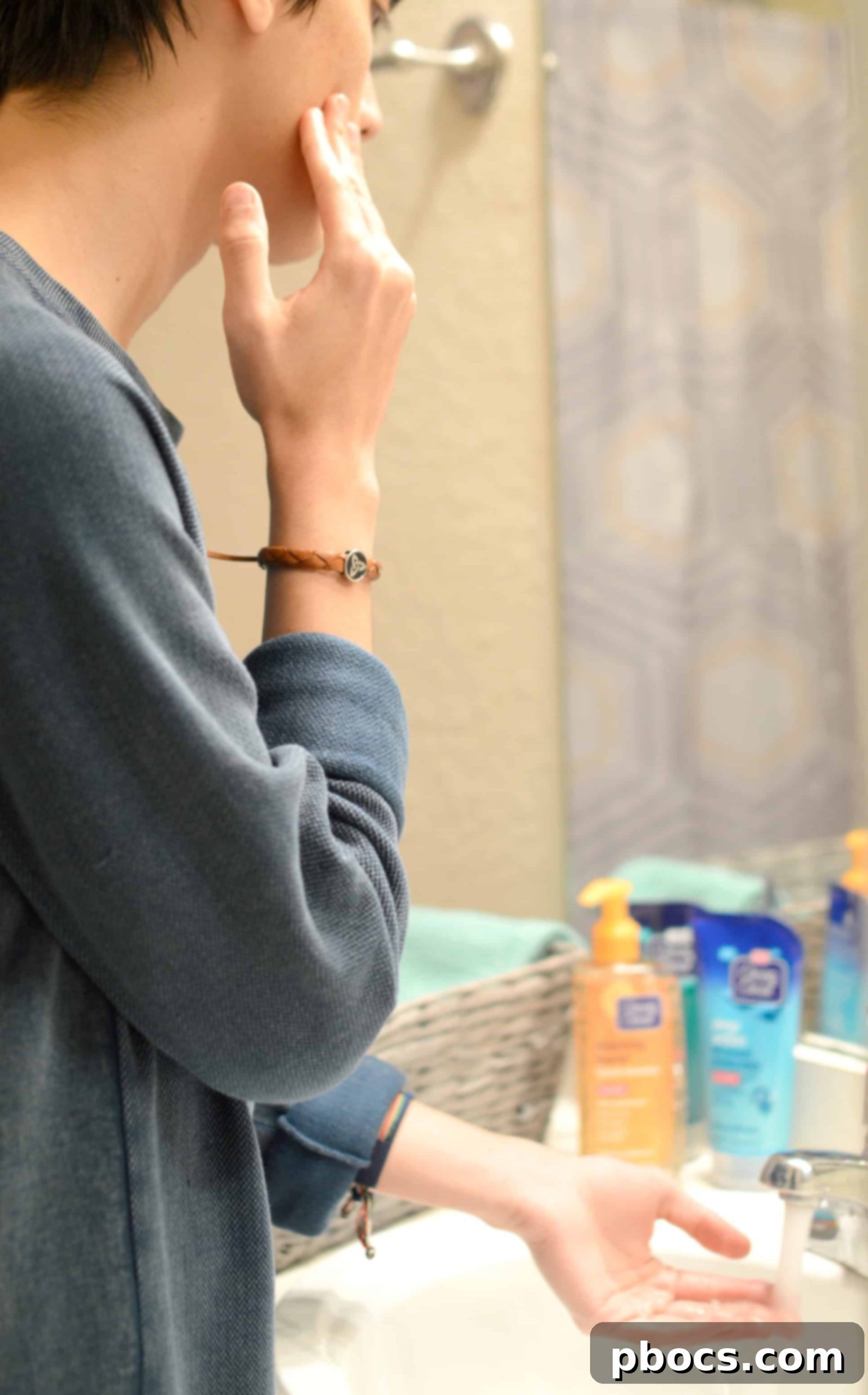 Close-up of teenage boy's face showing the 'BURSTING BEADS' in action