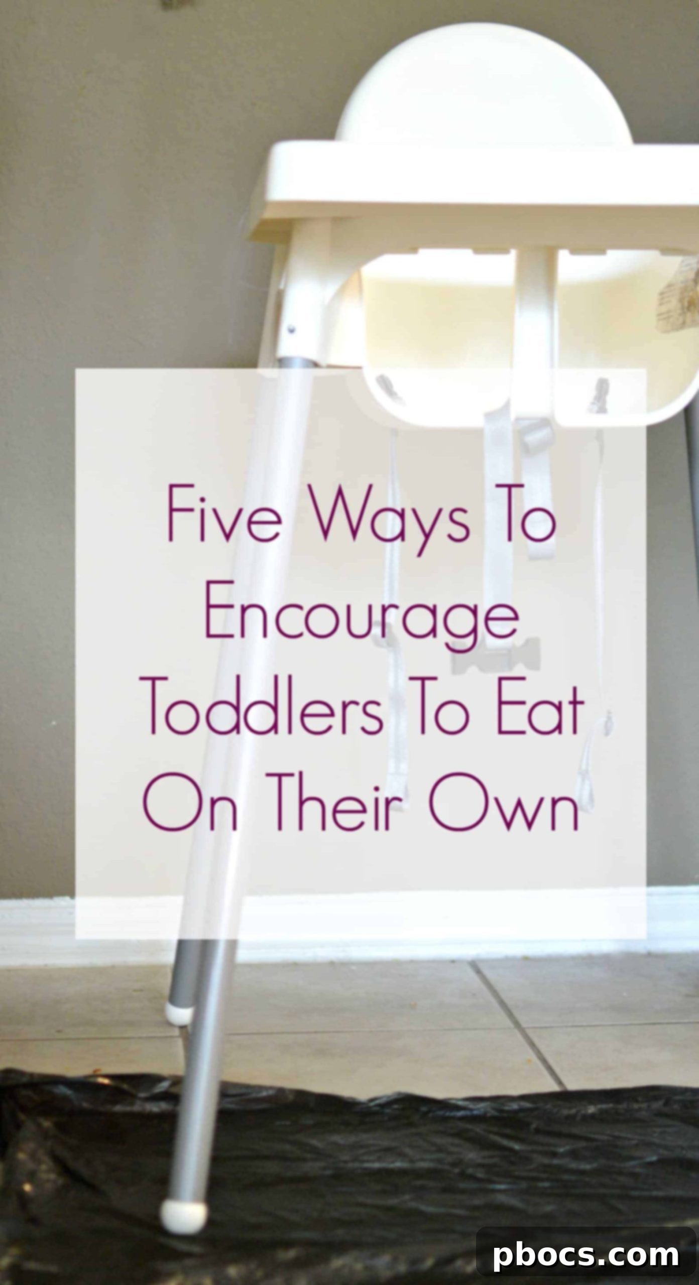 A toddler happily eating with their own utensils, encouraging self-feeding independence.