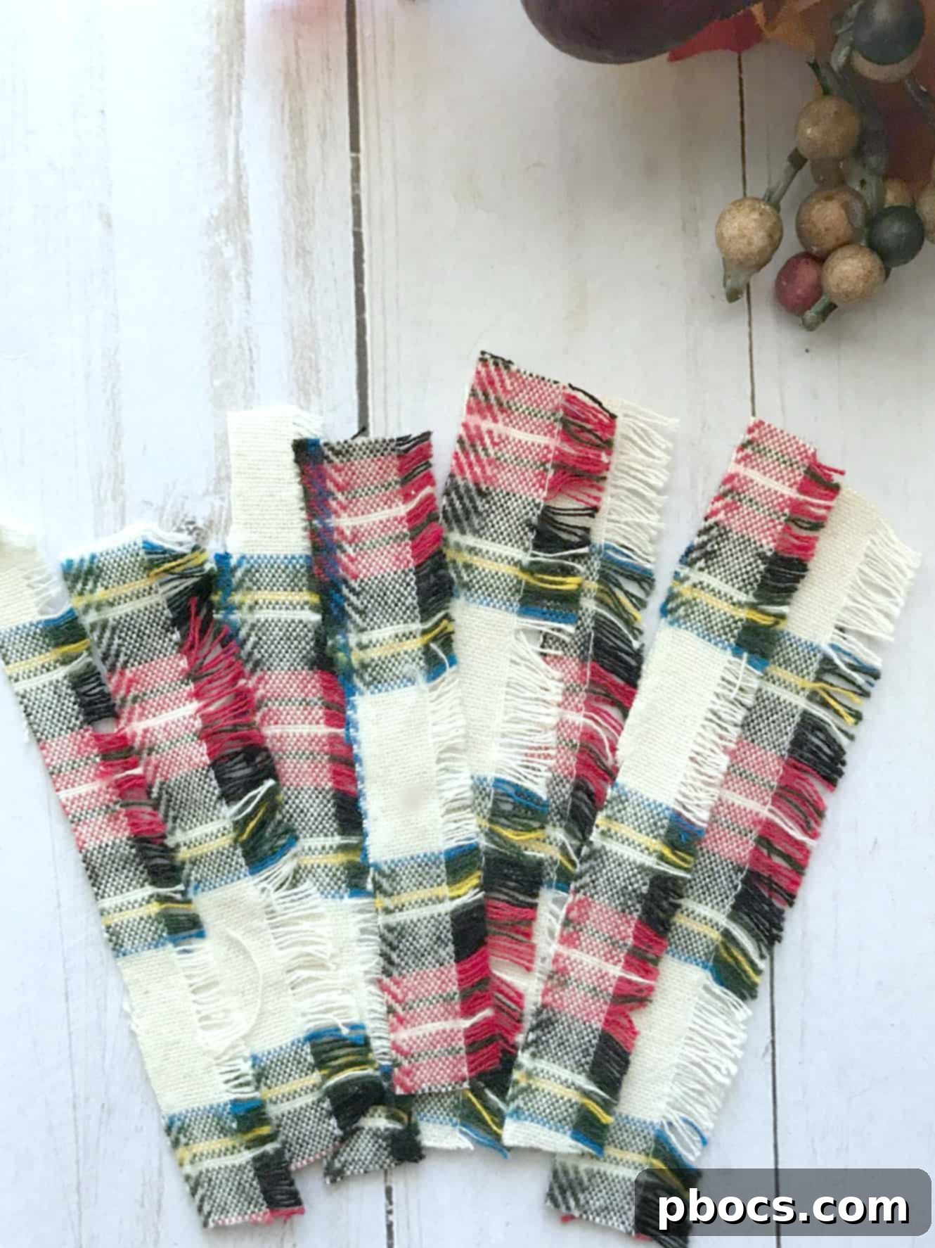 Fabric strips being cut for the DIY keychain project.