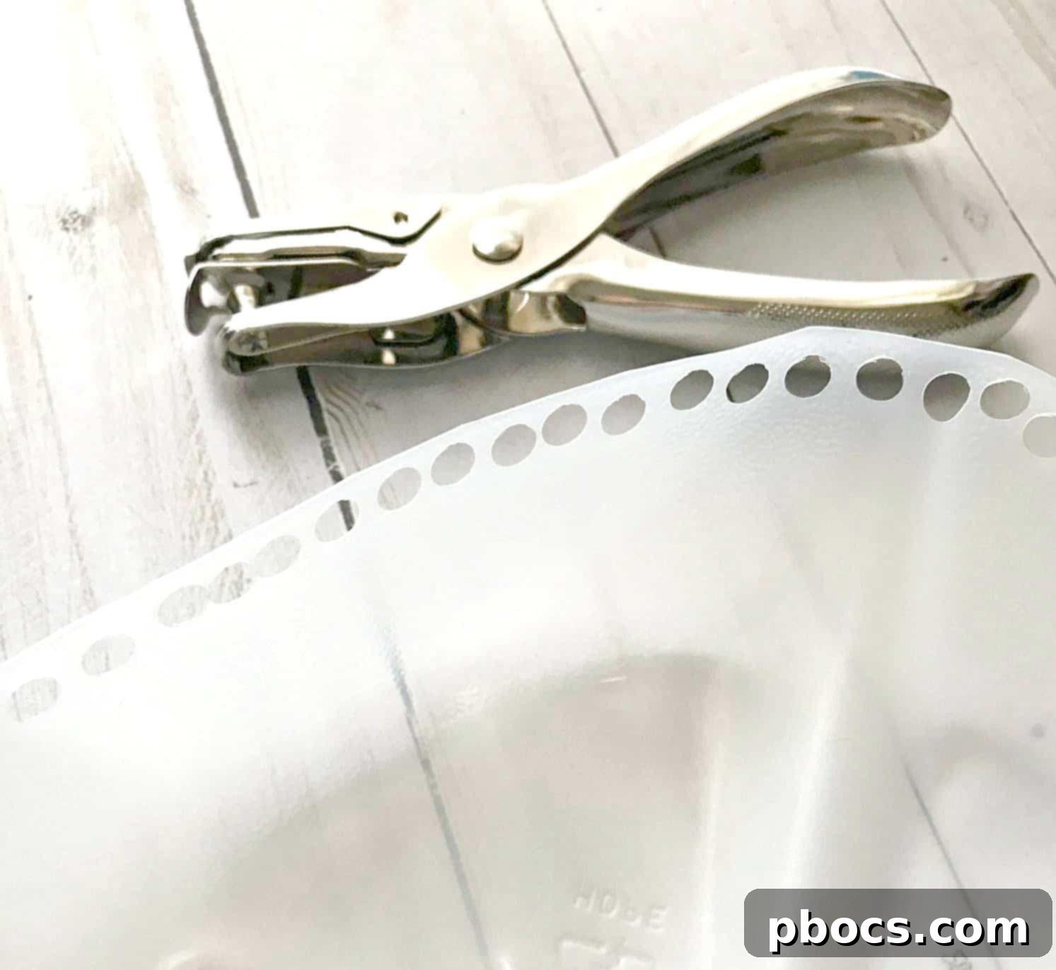 Punching holes in the plastic ring