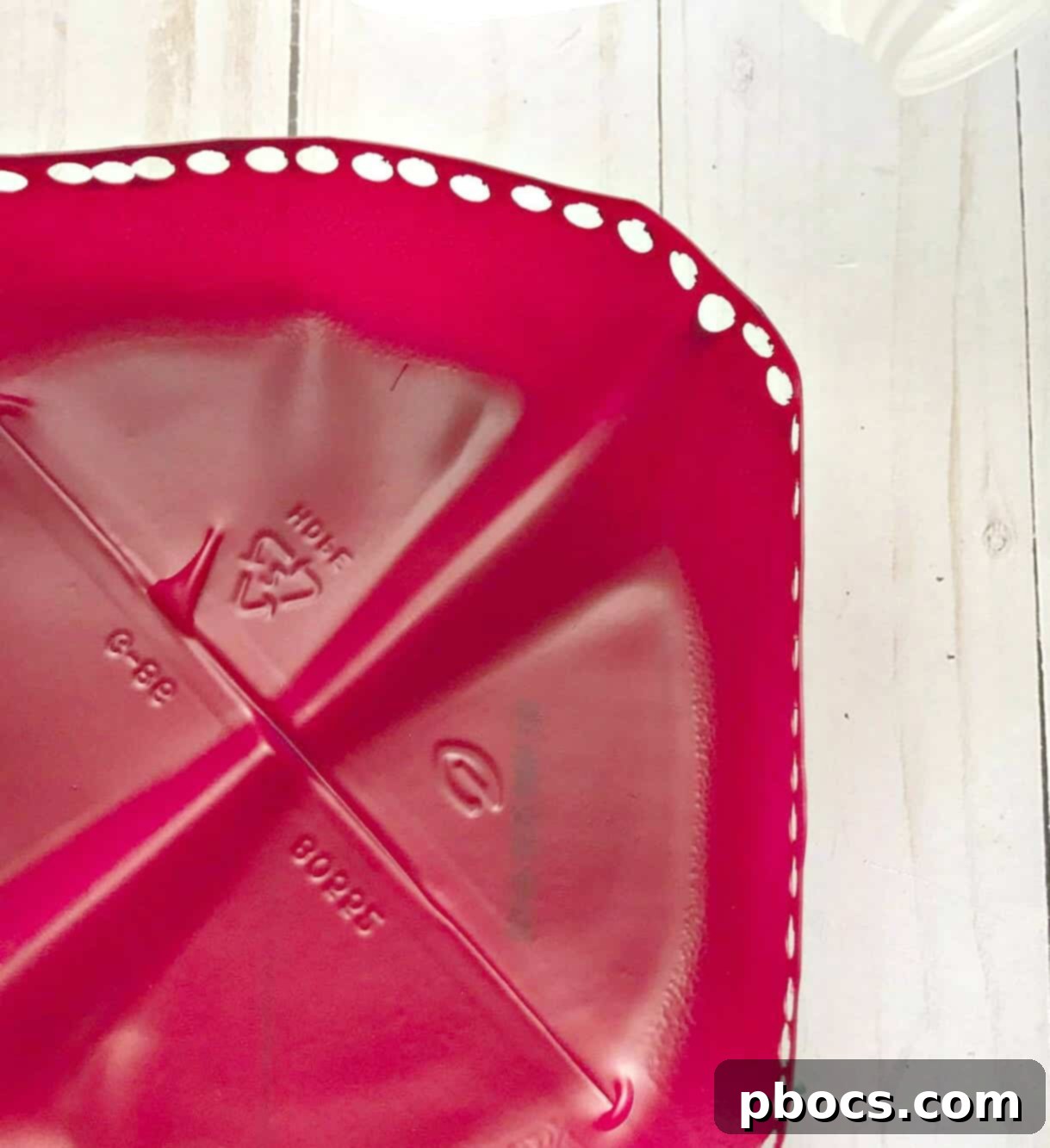 Spray painting the recycled water bottle base