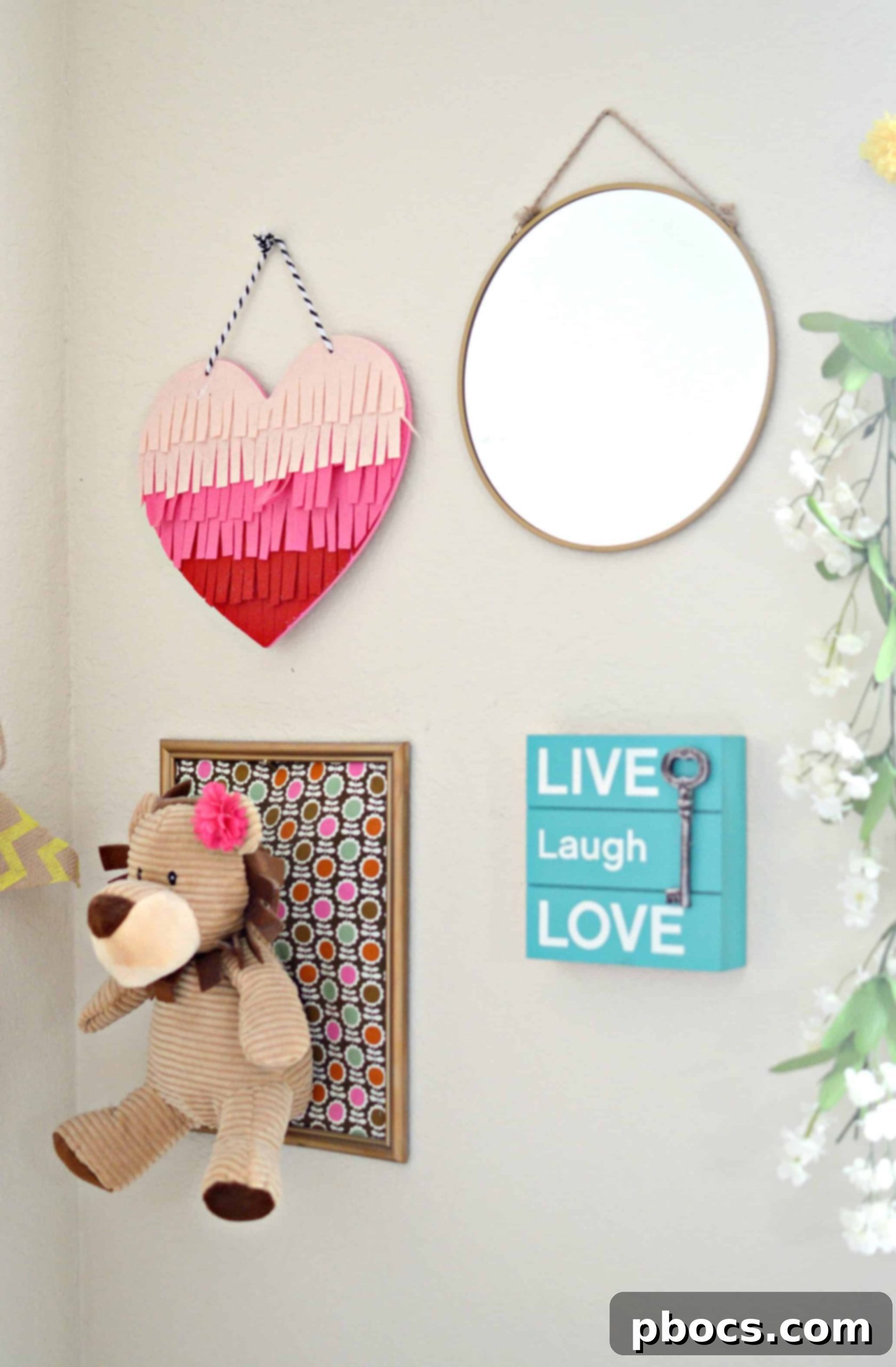 Inspirational framed quotes and baby essentials in a cozy nursery corner