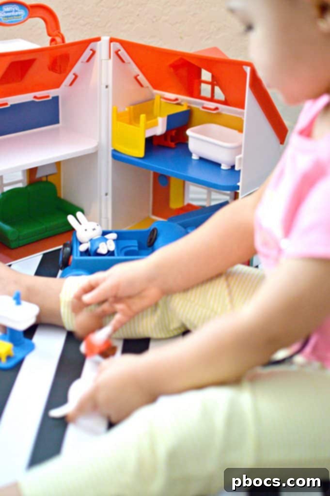 Close-up of Miffy and Melanie figures interacting with the playset furniture