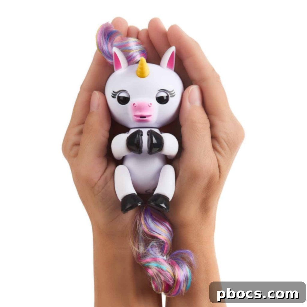 Child holding Fingerlings Baby Unicorn Gigi upside down for interaction