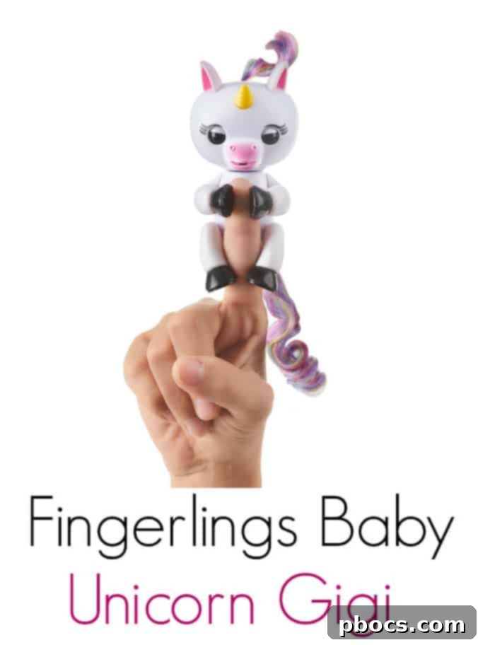 Fingerlings Baby Unicorn Gigi clinging to a child's finger with sparkling eyes