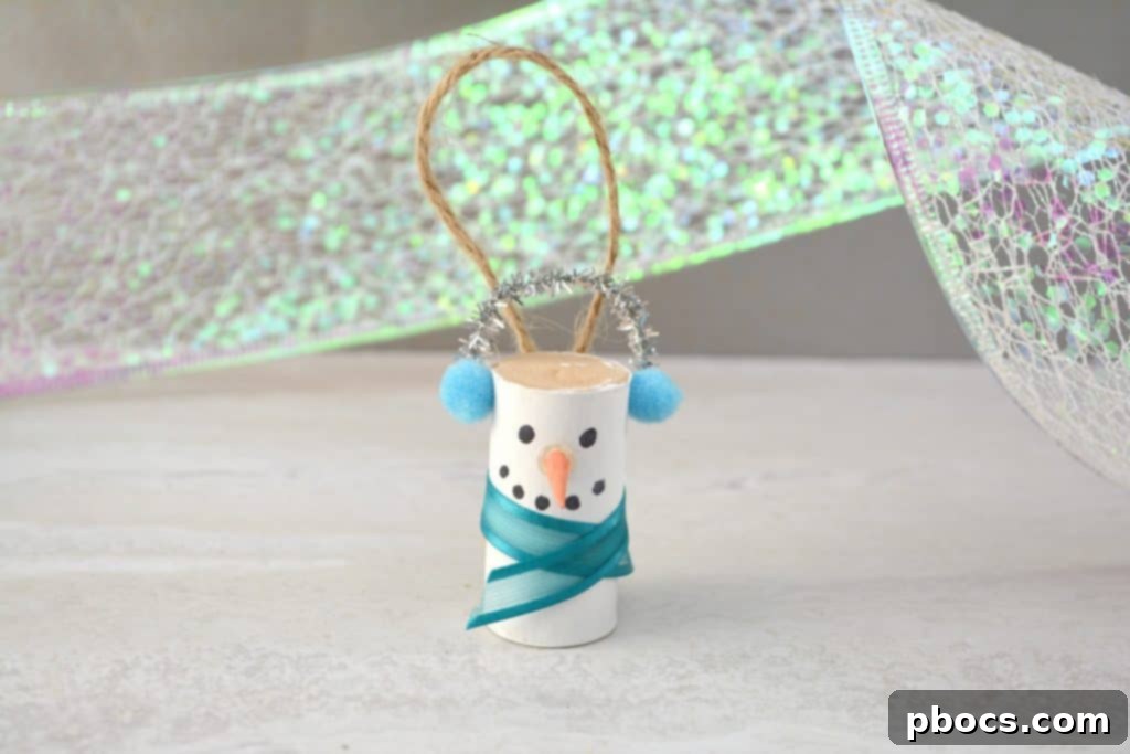 Adding a Twine Hanger to Your DIY Snowman Ornament Gluing a twine loop hanger to the back of the snowman ornament